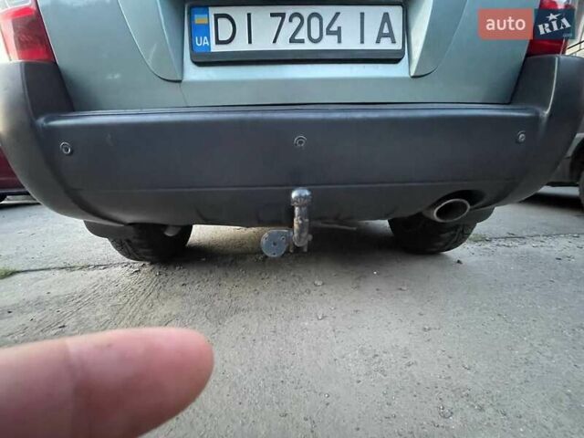 Зеленый Хендай Туксон, объемом двигателя 1.98 л и пробегом 205 тыс. км за 7700 $, фото 20 на Automoto.ua