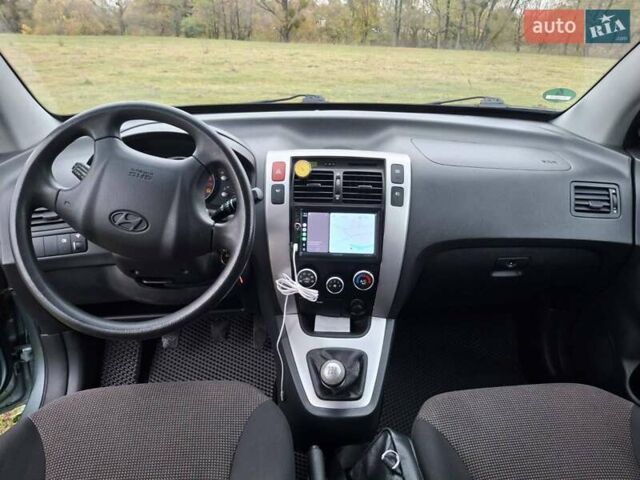 Зеленый Хендай Туксон, объемом двигателя 1.98 л и пробегом 129 тыс. км за 9200 $, фото 12 на Automoto.ua