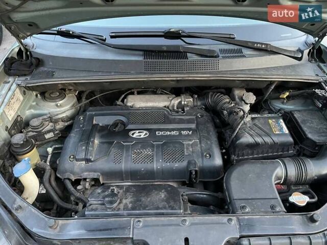 Зеленый Хендай Туксон, объемом двигателя 1.98 л и пробегом 205 тыс. км за 7700 $, фото 26 на Automoto.ua