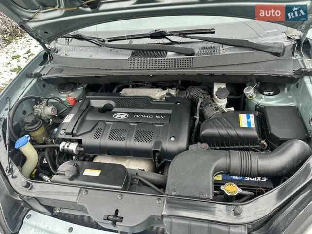 Зелений Хендай Туксон, об'ємом двигуна 2 л та пробігом 248 тис. км за 6999 $, фото 16 на Automoto.ua