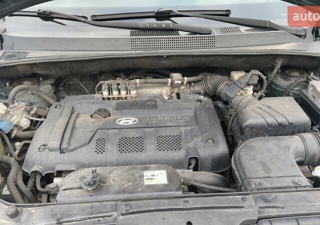 Зелений Хендай Туксон, об'ємом двигуна 1.98 л та пробігом 245 тис. км за 7800 $, фото 8 на Automoto.ua