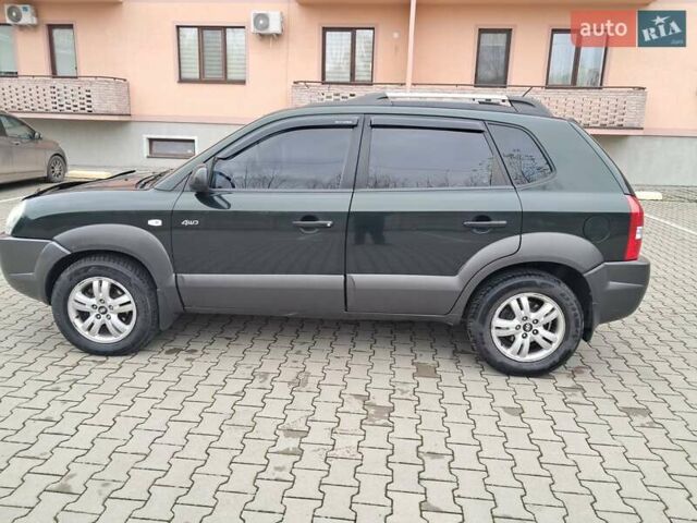 Зеленый Хендай Туксон, объемом двигателя 1.98 л и пробегом 280 тыс. км за 7200 $, фото 2 на Automoto.ua