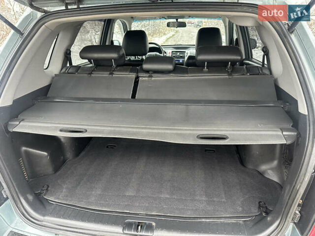 Зелений Хендай Туксон, об'ємом двигуна 2 л та пробігом 248 тис. км за 6999 $, фото 9 на Automoto.ua