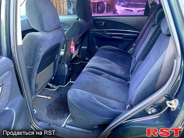 Зелений Хендай Туксон, об'ємом двигуна 2 л та пробігом 236 тис. км за 7600 $, фото 7 на Automoto.ua