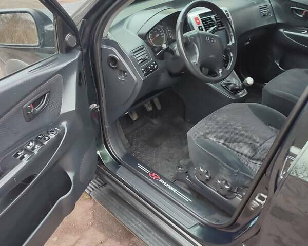 Зеленый Хендай Туксон, объемом двигателя 2 л и пробегом 213 тыс. км за 6500 $, фото 5 на Automoto.ua