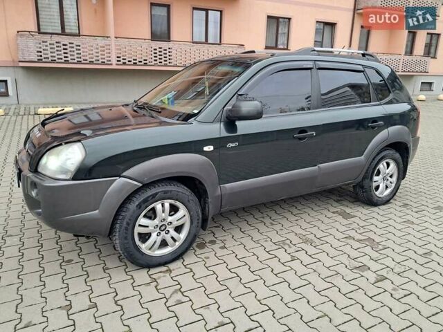 Зеленый Хендай Туксон, объемом двигателя 1.98 л и пробегом 280 тыс. км за 7200 $, фото 1 на Automoto.ua