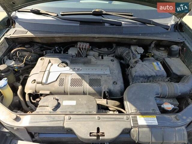 Зеленый Хендай Туксон, объемом двигателя 2 л и пробегом 203 тыс. км за 7800 $, фото 9 на Automoto.ua