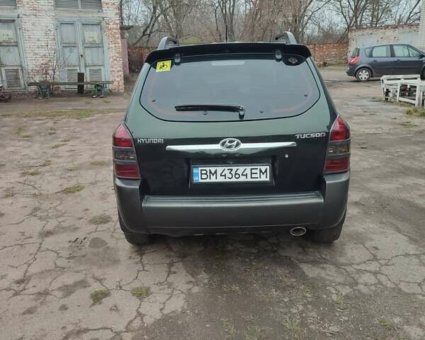 Зеленый Хендай Туксон, объемом двигателя 2 л и пробегом 213 тыс. км за 6500 $, фото 7 на Automoto.ua