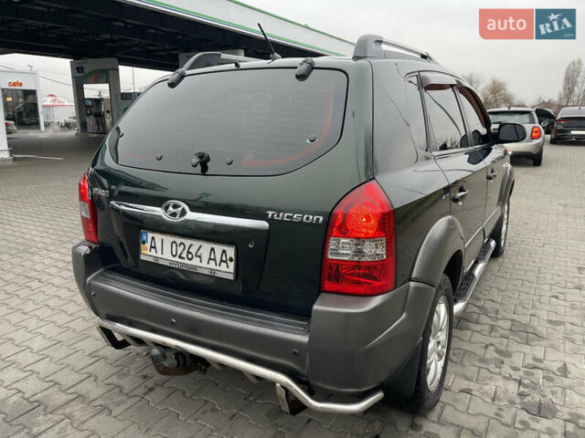 Зеленый Хендай Туксон, объемом двигателя 1.98 л и пробегом 295 тыс. км за 5950 $, фото 6 на Automoto.ua