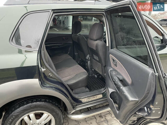 Зеленый Хендай Туксон, объемом двигателя 1.98 л и пробегом 295 тыс. км за 5950 $, фото 20 на Automoto.ua