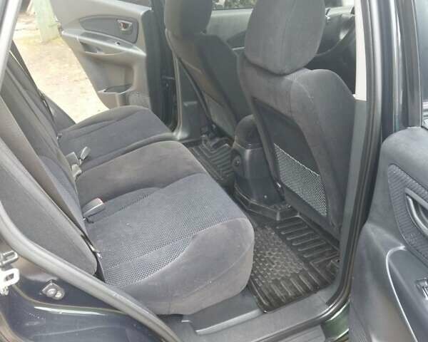 Зелений Хендай Туксон, об'ємом двигуна 2 л та пробігом 94 тис. км за 9000 $, фото 6 на Automoto.ua