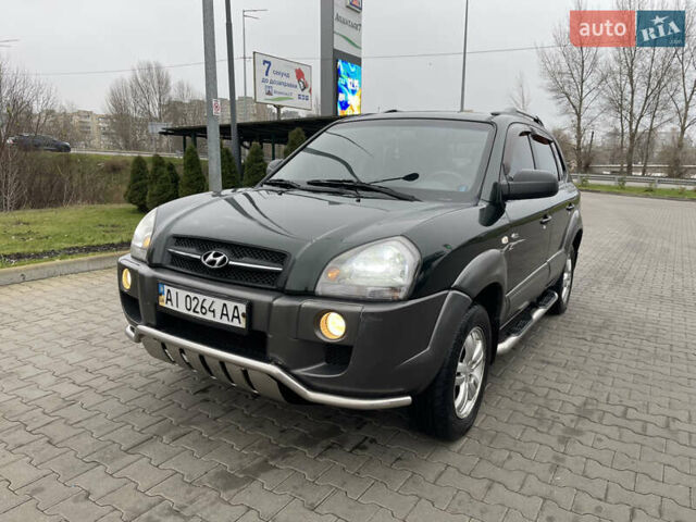 Зеленый Хендай Туксон, объемом двигателя 1.98 л и пробегом 295 тыс. км за 5950 $, фото 1 на Automoto.ua