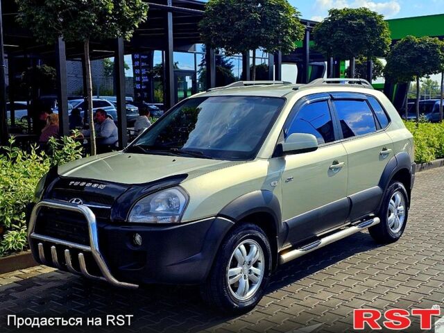 Зеленый Хендай Туксон, объемом двигателя 2 л и пробегом 186 тыс. км за 8600 $, фото 1 на Automoto.ua