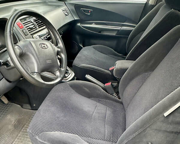 Зелений Хендай Туксон, об'ємом двигуна 1.98 л та пробігом 156 тис. км за 7999 $, фото 11 на Automoto.ua