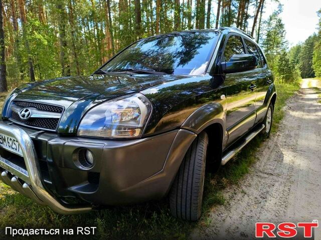 Зеленый Хендай Туксон, объемом двигателя 2 л и пробегом 190 тыс. км за 8500 $, фото 4 на Automoto.ua