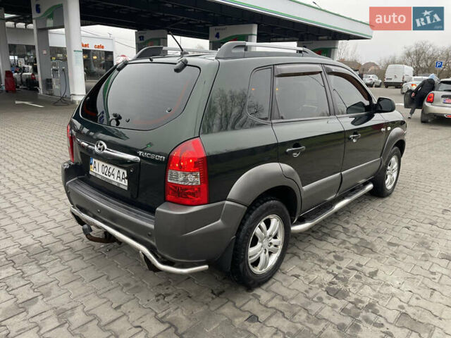 Зеленый Хендай Туксон, объемом двигателя 1.98 л и пробегом 295 тыс. км за 5950 $, фото 31 на Automoto.ua
