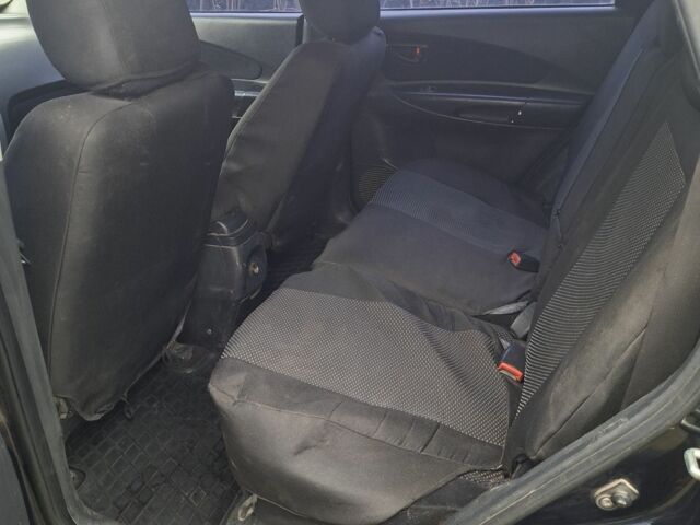 Зеленый Хендай Туксон, объемом двигателя 2 л и пробегом 228 тыс. км за 6500 $, фото 9 на Automoto.ua