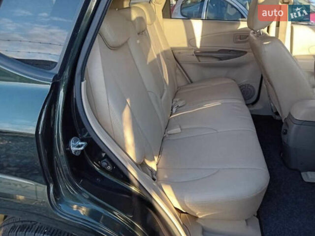 Зеленый Хендай Туксон, объемом двигателя 2 л и пробегом 183 тыс. км за 8900 $, фото 4 на Automoto.ua