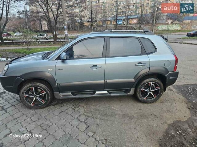 Зеленый Хендай Туксон, объемом двигателя 1.98 л и пробегом 158 тыс. км за 8300 $, фото 3 на Automoto.ua