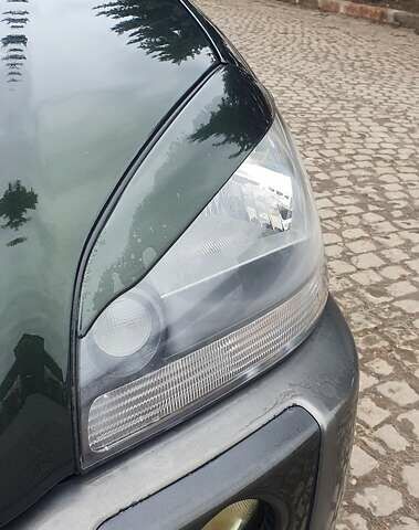 Зеленый Хендай Туксон, объемом двигателя 2 л и пробегом 115 тыс. км за 8500 $, фото 13 на Automoto.ua