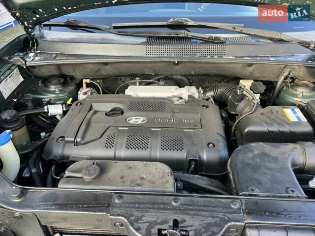 Зеленый Хендай Туксон, объемом двигателя 1.98 л и пробегом 130 тыс. км за 9100 $, фото 8 на Automoto.ua