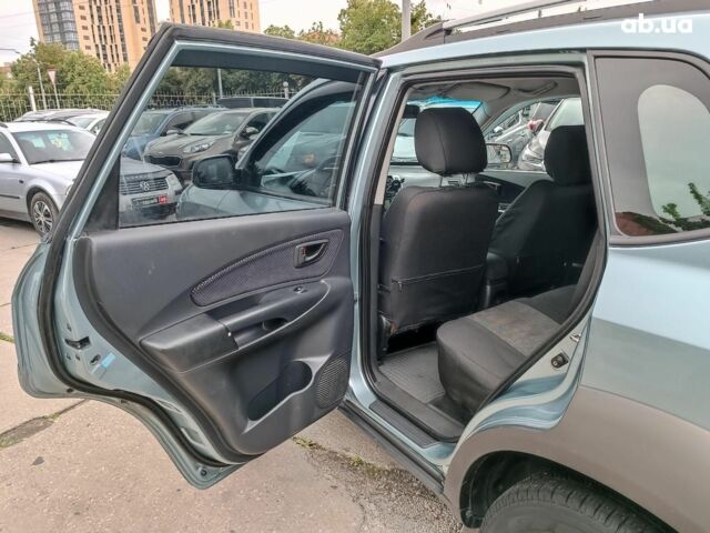 Зелений Хендай Туксон, об'ємом двигуна 2 л та пробігом 314 тис. км за 7790 $, фото 21 на Automoto.ua