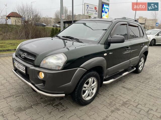 Зеленый Хендай Туксон, объемом двигателя 1.98 л и пробегом 295 тыс. км за 5950 $, фото 28 на Automoto.ua