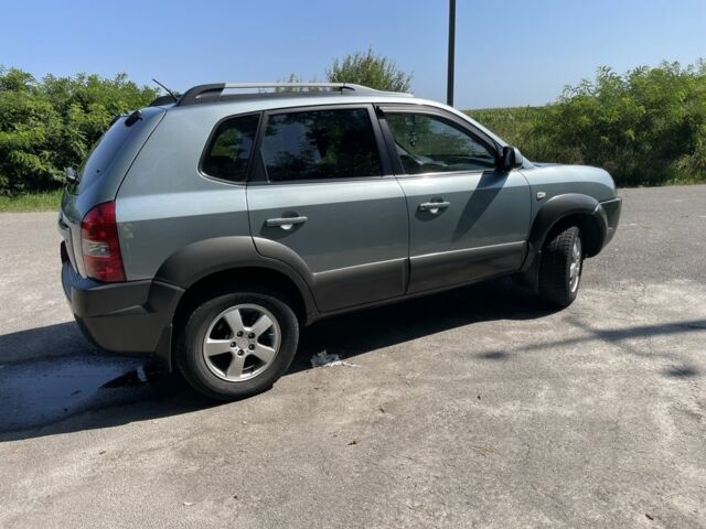 Зеленый Хендай Туксон, объемом двигателя 2 л и пробегом 130 тыс. км за 9100 $, фото 6 на Automoto.ua