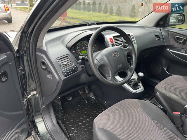 Зеленый Хендай Туксон, объемом двигателя 1.98 л и пробегом 295 тыс. км за 5950 $, фото 15 на Automoto.ua