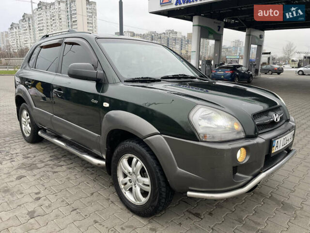 Зеленый Хендай Туксон, объемом двигателя 1.98 л и пробегом 295 тыс. км за 5950 $, фото 9 на Automoto.ua