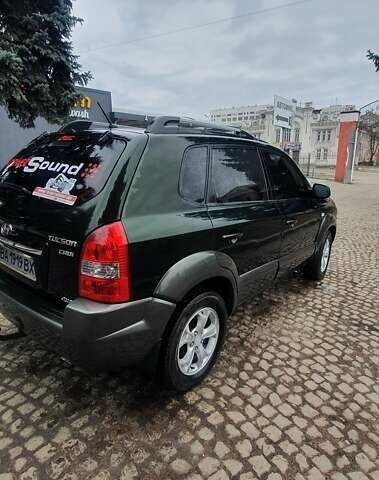 Зеленый Хендай Туксон, объемом двигателя 2 л и пробегом 115 тыс. км за 8500 $, фото 2 на Automoto.ua