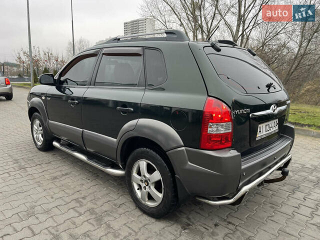 Зеленый Хендай Туксон, объемом двигателя 1.98 л и пробегом 295 тыс. км за 5950 $, фото 3 на Automoto.ua
