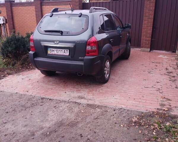 Зеленый Хендай Туксон, объемом двигателя 1.98 л и пробегом 146 тыс. км за 10000 $, фото 2 на Automoto.ua