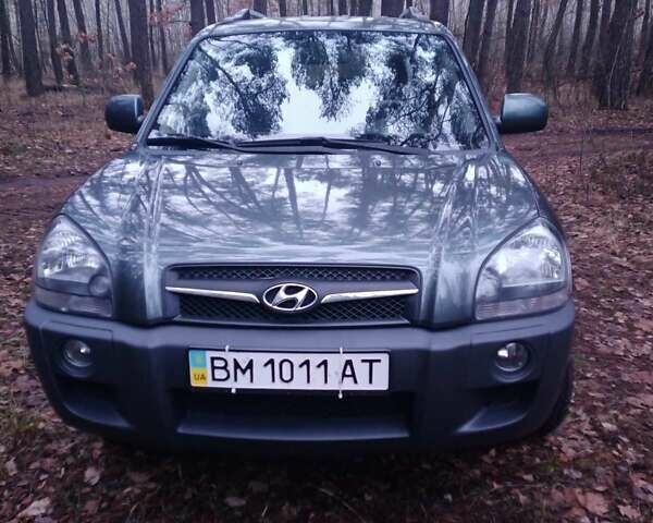 Зеленый Хендай Туксон, объемом двигателя 1.98 л и пробегом 146 тыс. км за 10000 $, фото 12 на Automoto.ua