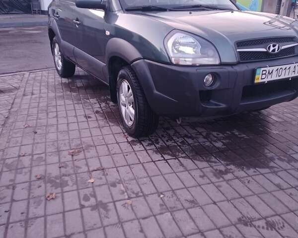 Зеленый Хендай Туксон, объемом двигателя 1.98 л и пробегом 146 тыс. км за 10000 $, фото 3 на Automoto.ua