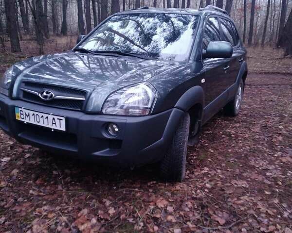 Зеленый Хендай Туксон, объемом двигателя 1.98 л и пробегом 146 тыс. км за 10000 $, фото 11 на Automoto.ua