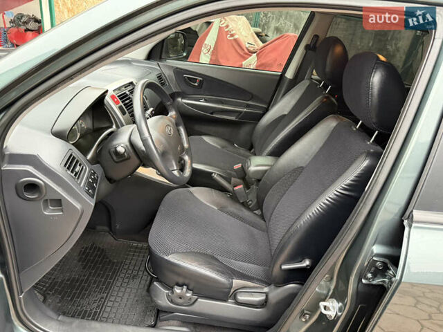 Зелений Хендай Туксон, об'ємом двигуна 2 л та пробігом 65 тис. км за 12250 $, фото 46 на Automoto.ua