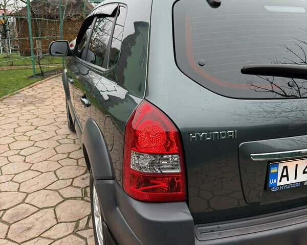 Зелений Хендай Туксон, об'ємом двигуна 2 л та пробігом 65 тис. км за 12250 $, фото 20 на Automoto.ua