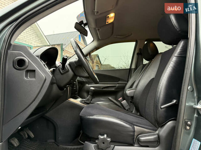 Зелений Хендай Туксон, об'ємом двигуна 2 л та пробігом 65 тис. км за 12250 $, фото 47 на Automoto.ua