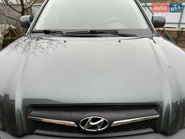 Зелений Хендай Туксон, об'ємом двигуна 2 л та пробігом 65 тис. км за 12250 $, фото 31 на Automoto.ua