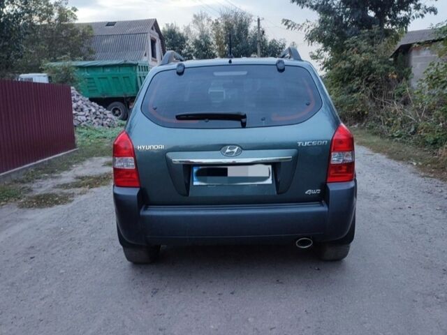 Зеленый Хендай Туксон, объемом двигателя 2 л и пробегом 97 тыс. км за 9600 $, фото 3 на Automoto.ua