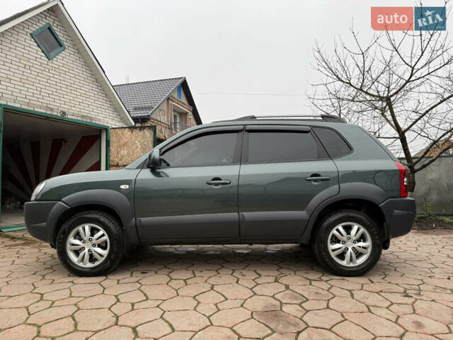 Зелений Хендай Туксон, об'ємом двигуна 2 л та пробігом 65 тис. км за 12250 $, фото 16 на Automoto.ua