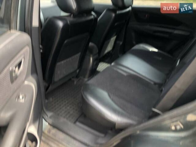 Зеленый Хендай Туксон, объемом двигателя 1.98 л и пробегом 410 тыс. км за 8000 $, фото 6 на Automoto.ua