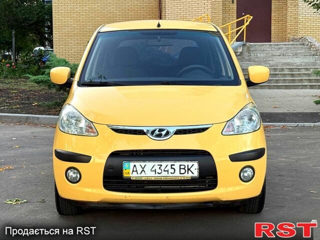 Желтый Хендай и10, объемом двигателя 1.1 л и пробегом 125 тыс. км за 6500 $, фото 1 на Automoto.ua