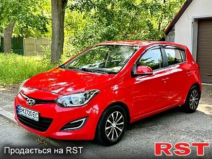 Красный Хендай и20, объемом двигателя 1.4 л и пробегом 155 тыс. км за 8550 $, фото 1 на Automoto.ua
