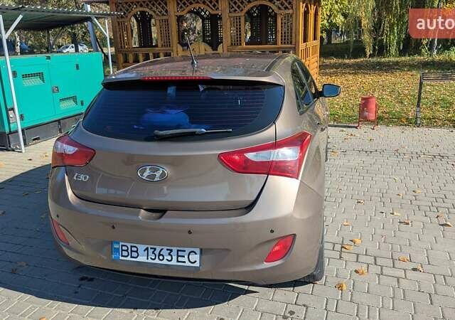 Бежевий Хендай i30, об'ємом двигуна 1.4 л та пробігом 156 тис. км за 8000 $, фото 3 на Automoto.ua