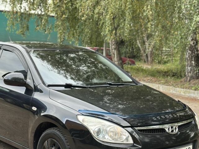 Черный Хендай i30, объемом двигателя 1.6 л и пробегом 240 тыс. км за 5999 $, фото 1 на Automoto.ua