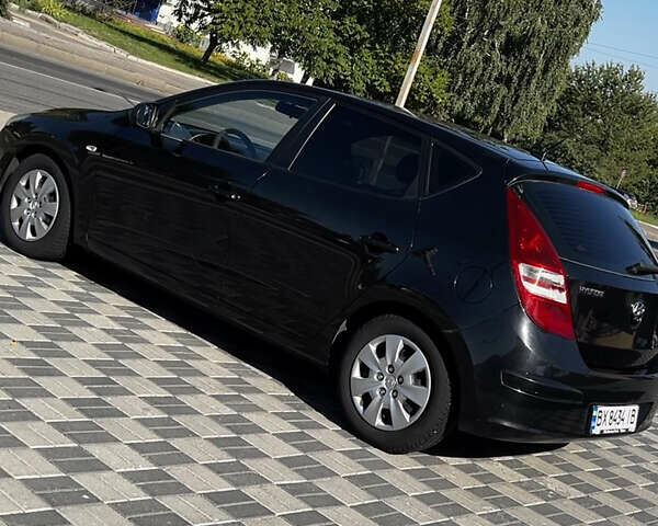 Черный Хендай i30, объемом двигателя 1.4 л и пробегом 267 тыс. км за 5400 $, фото 1 на Automoto.ua
