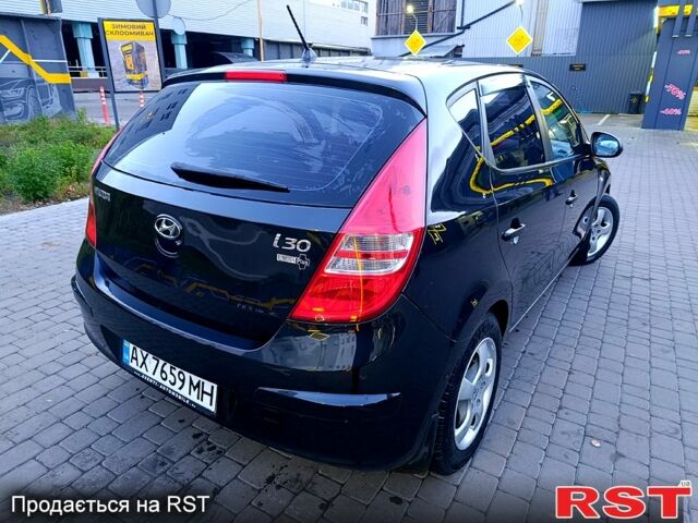 Черный Хендай i30, объемом двигателя 1.4 л и пробегом 170 тыс. км за 5800 $, фото 4 на Automoto.ua