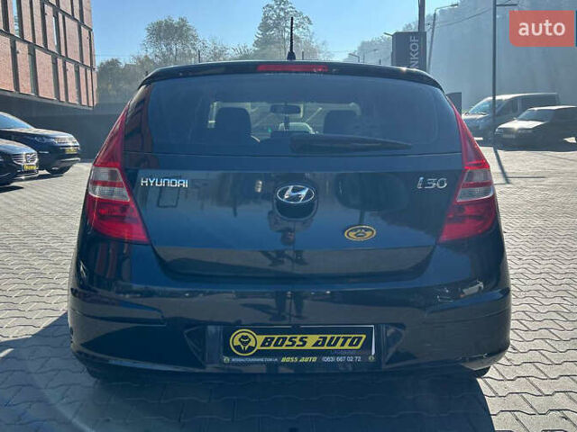 Черный Хендай i30, объемом двигателя 1.4 л и пробегом 220 тыс. км за 5500 $, фото 4 на Automoto.ua